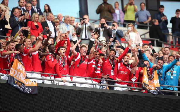 Salford City celebrate winning the play-off final at Wembley