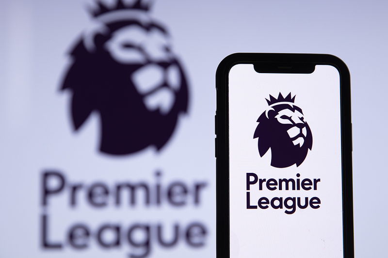 premier league and logo shown on phone and in background